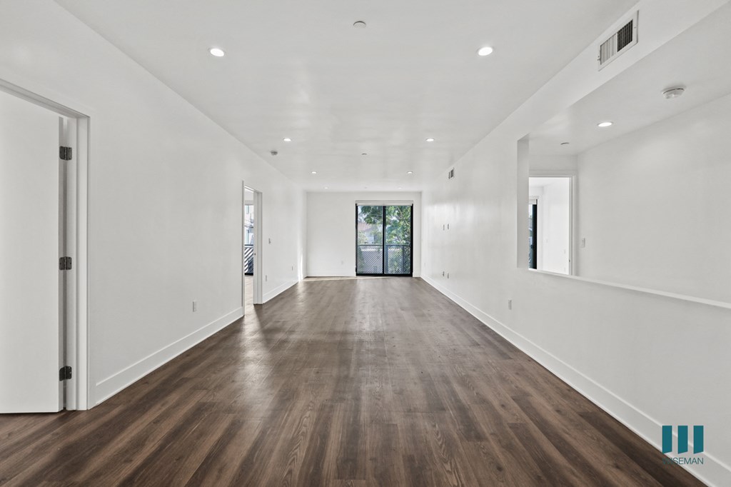 Open-Concept Living and Dining Room Space with Patio