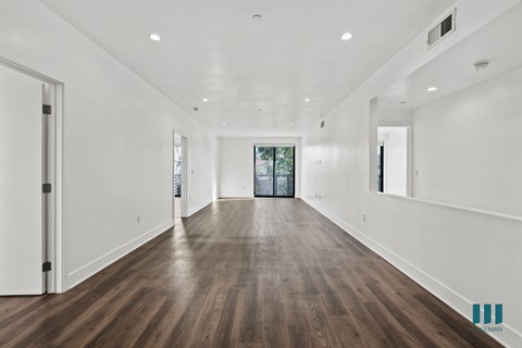 Open-Concept Living and Dining Room Space with Patio