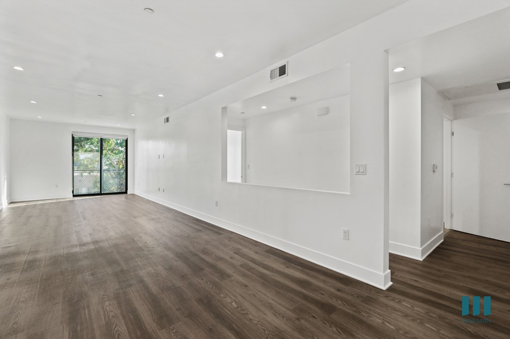 Open-Concept Dining and Living room Space with Balcony, Vinyl Flooring, and Recessed Lighting