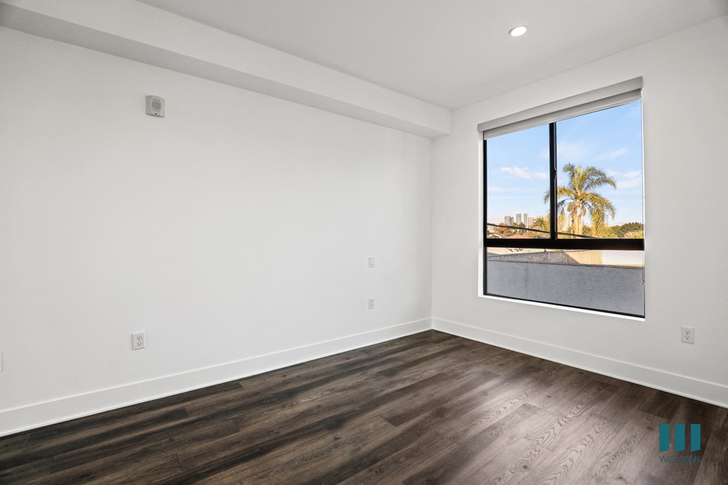 Bedroom with Large-Size Windows, Recessed Lighting, and Vinyl Flooring