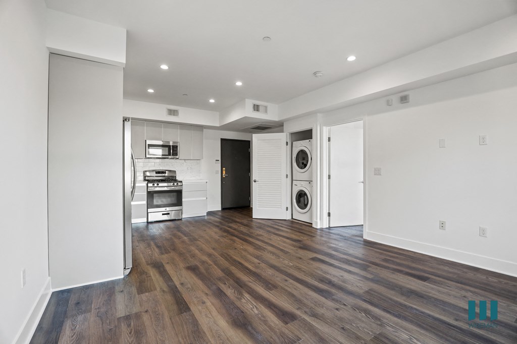 Open-Concept Kitchen, Dining, and Living Rooms with In-Suite Washer & Dryer