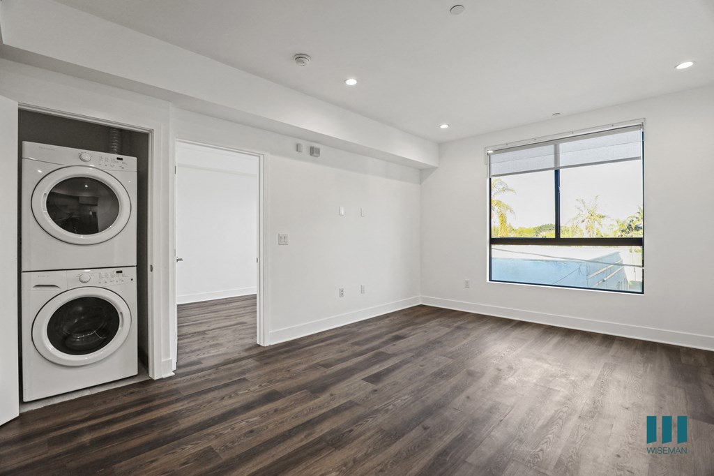 In-Suite Washer& Dryer, Living zoom with Large-Windows, Recessed Lighting, and Vinyl Flooring