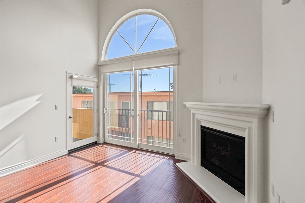 Living Room with Electric Fireplace and Patio