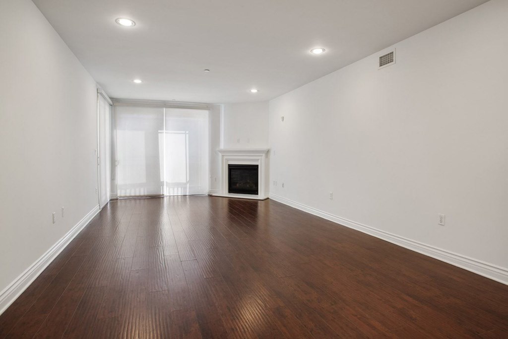 Living Room with Electric Fireplace, Recessed Lighting, Vinyl Flooring, and Patio