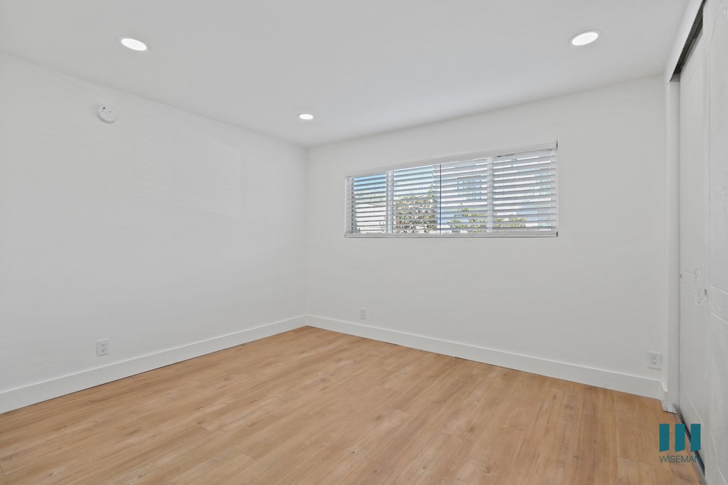 Bedroom with Vinyl Flooring, Recessed Lighting, and Window