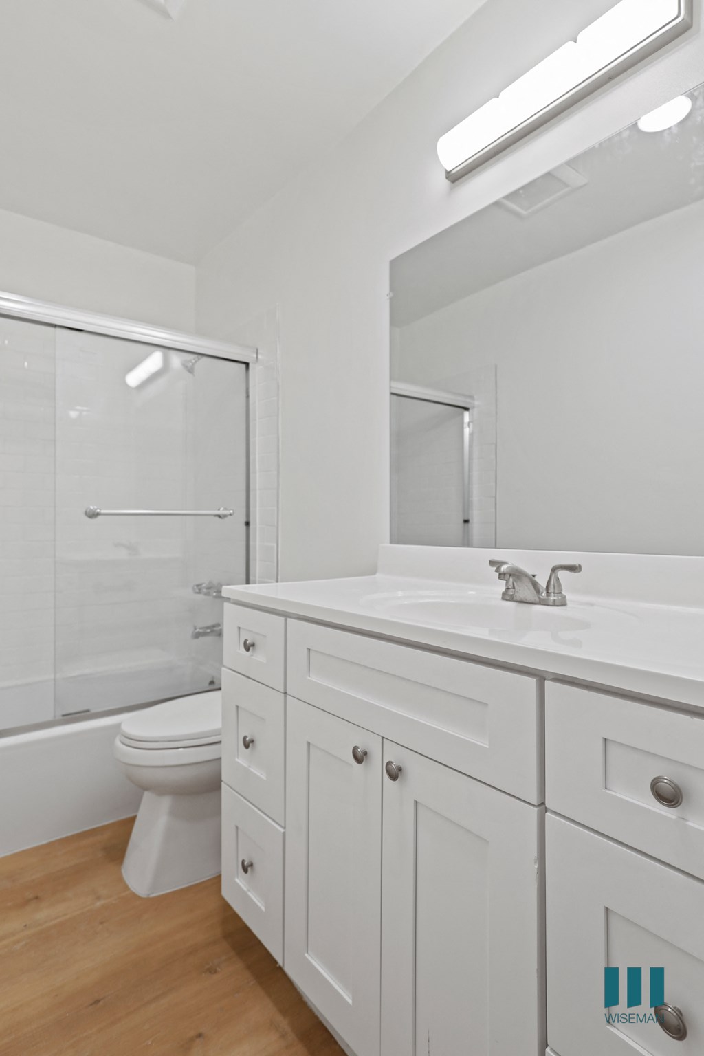 Bathroom with Shower Bath with Glass Door and Vanity Cabinet Storage