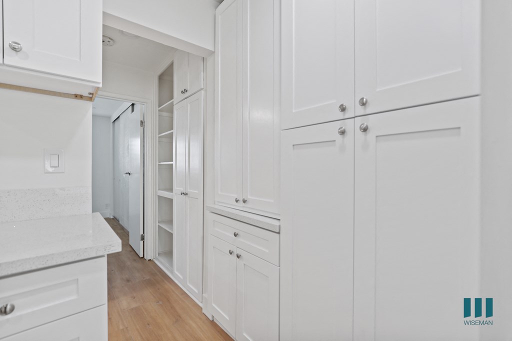Ample Kitchen and Hallway Cabinet Storage