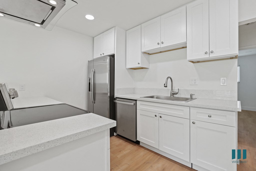 Kitchen with Stainless-Steel Refrigerator, Dishwasher, and Stove