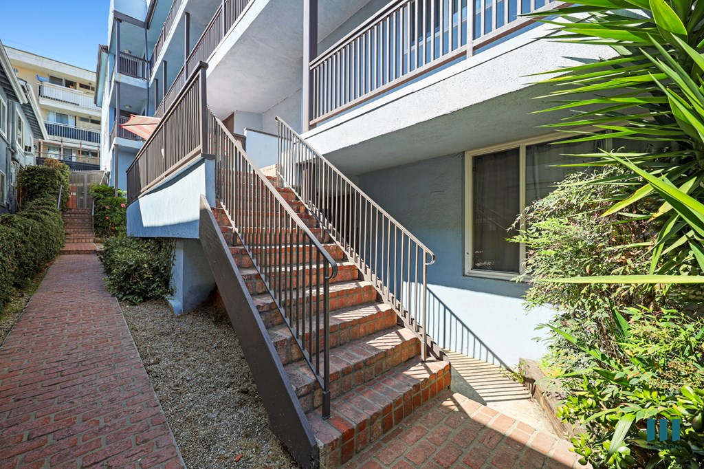 Side Exterior and Staircase to Upper Level