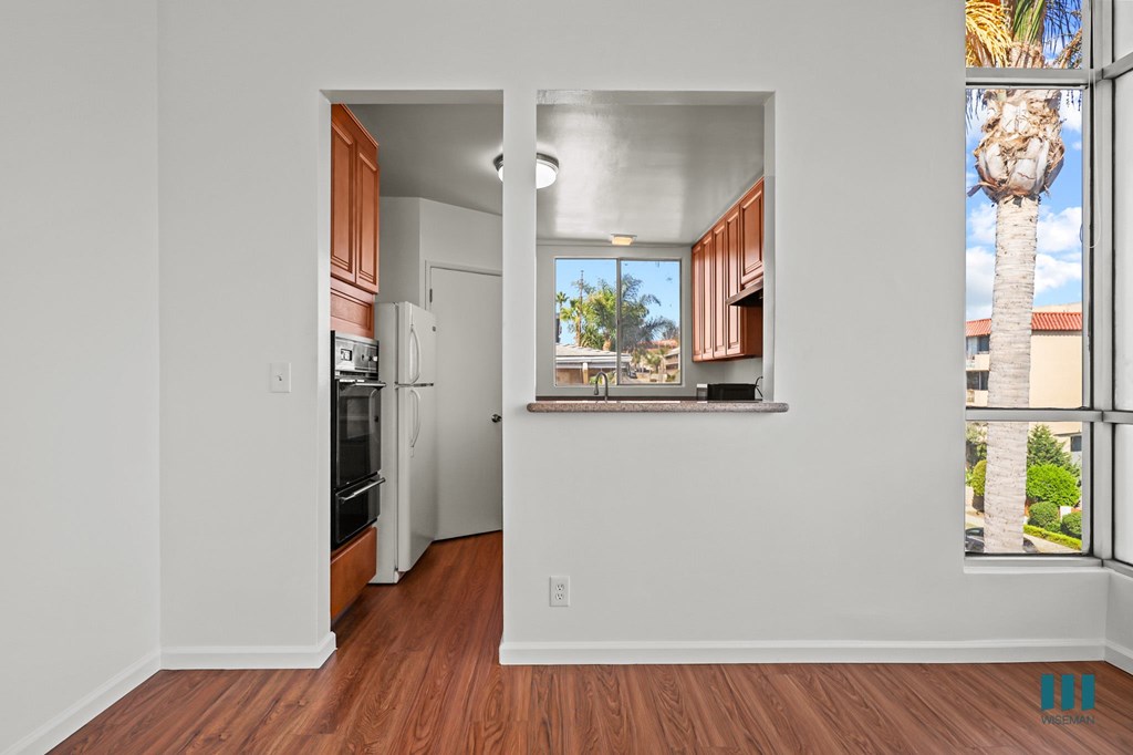 Dining Area with Large-Size Windows and Kitchen