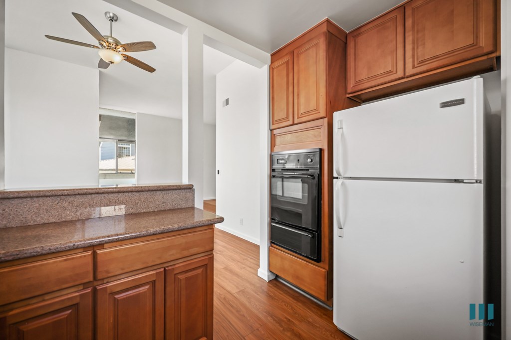Kitchen with Refrigerator, Stove, and Ample Cabinet Storage