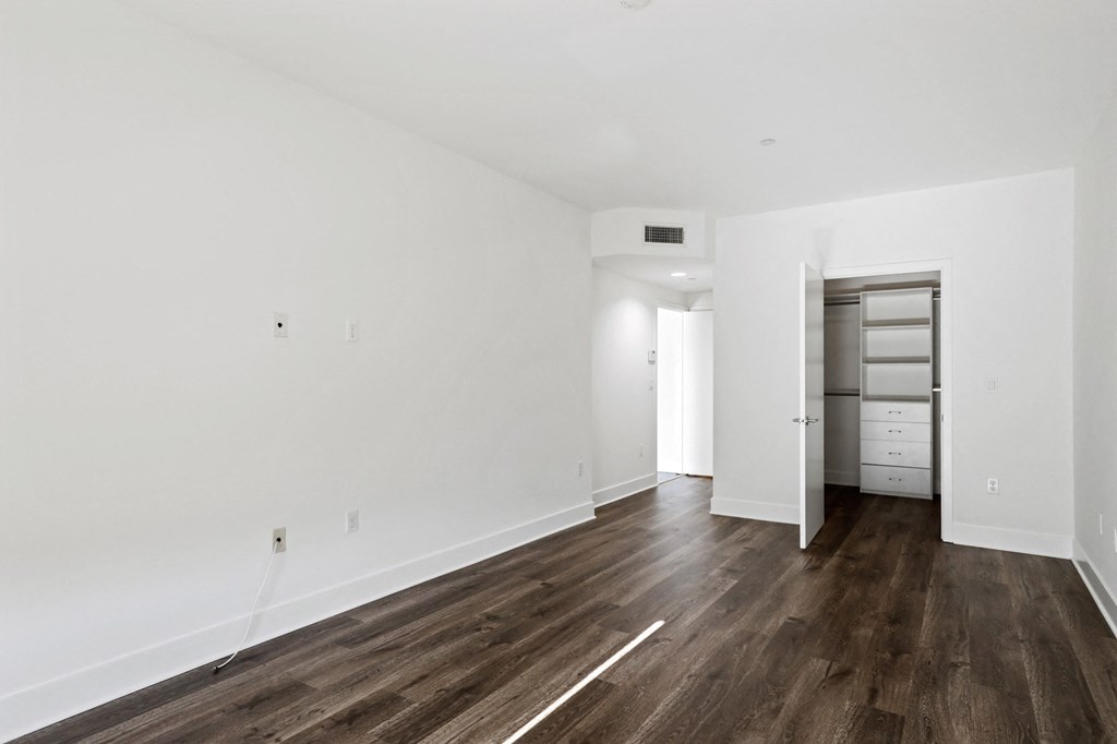 Bedroom with Closet with Built-In Shelving
