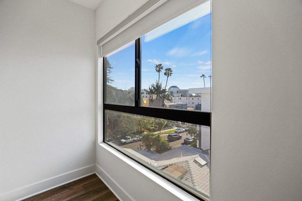Bedroom with Large Windows with Views of the City