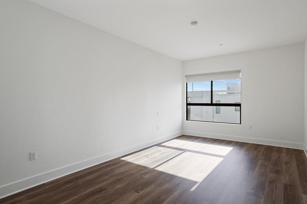 Bedroom with Vinyl Flooring and Large Windows
