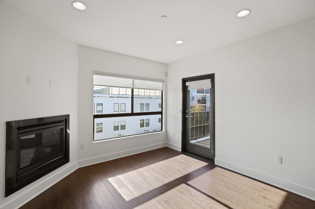 Living Room with Electric Fireplace, Recessed Lighting, Vinyl Flooring, and Patio