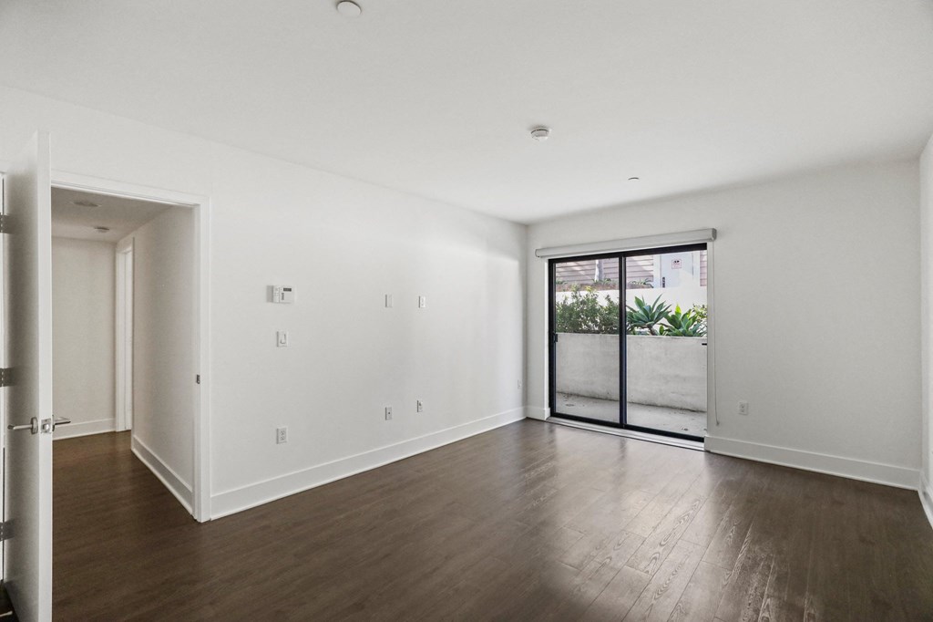 Spacious Bedroom with Vinyl Flooring and Patio