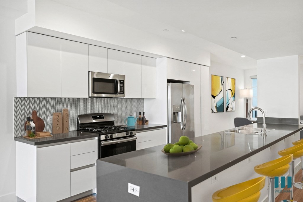 Kitchen with Energy-Efficient Appliances and Countertop Bar