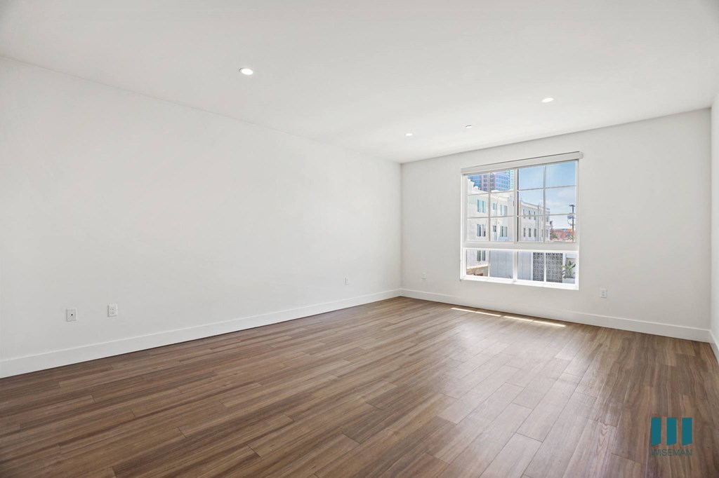 Spacious Bedroom wwith Large-Size Window, Vinyl Flooring, and Recessed Lighting