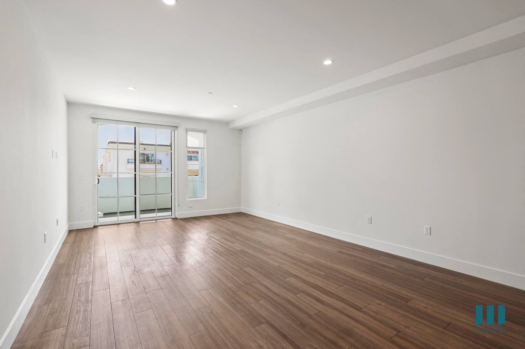 Living Room with Patio, Windows, Vinyl Flooring, and Recessed Lighting
