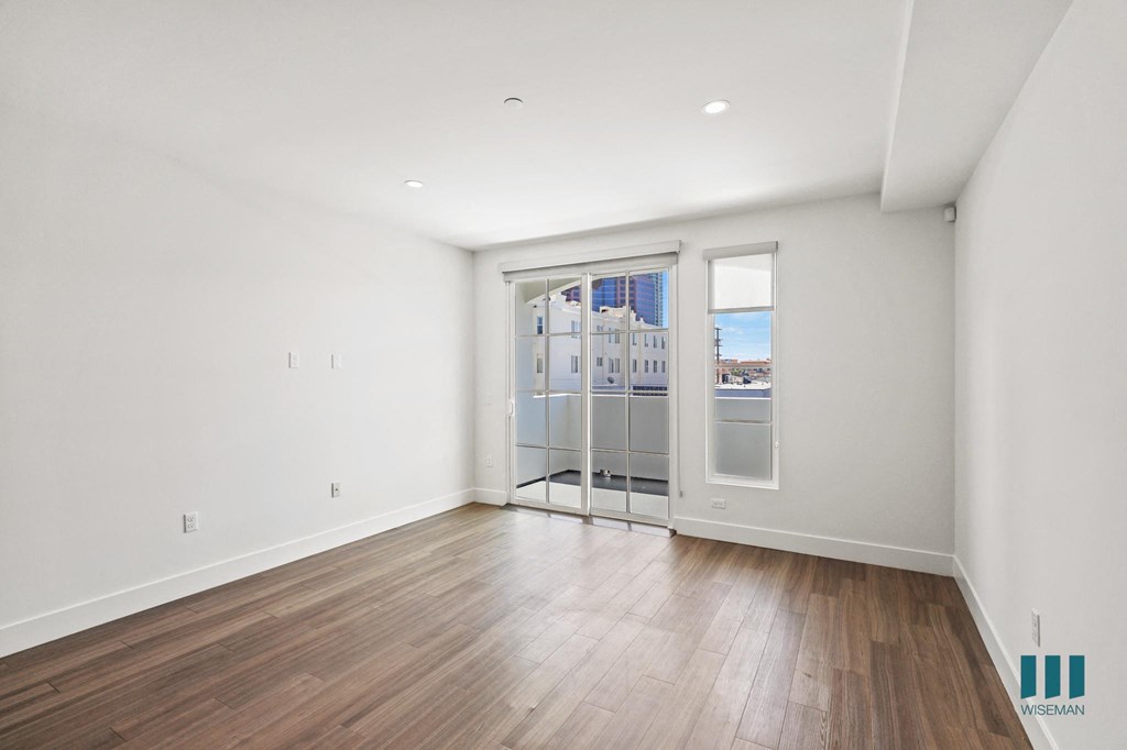 Bedroom with Patio Access, Vinyl Flooring, and Recessed Lighting