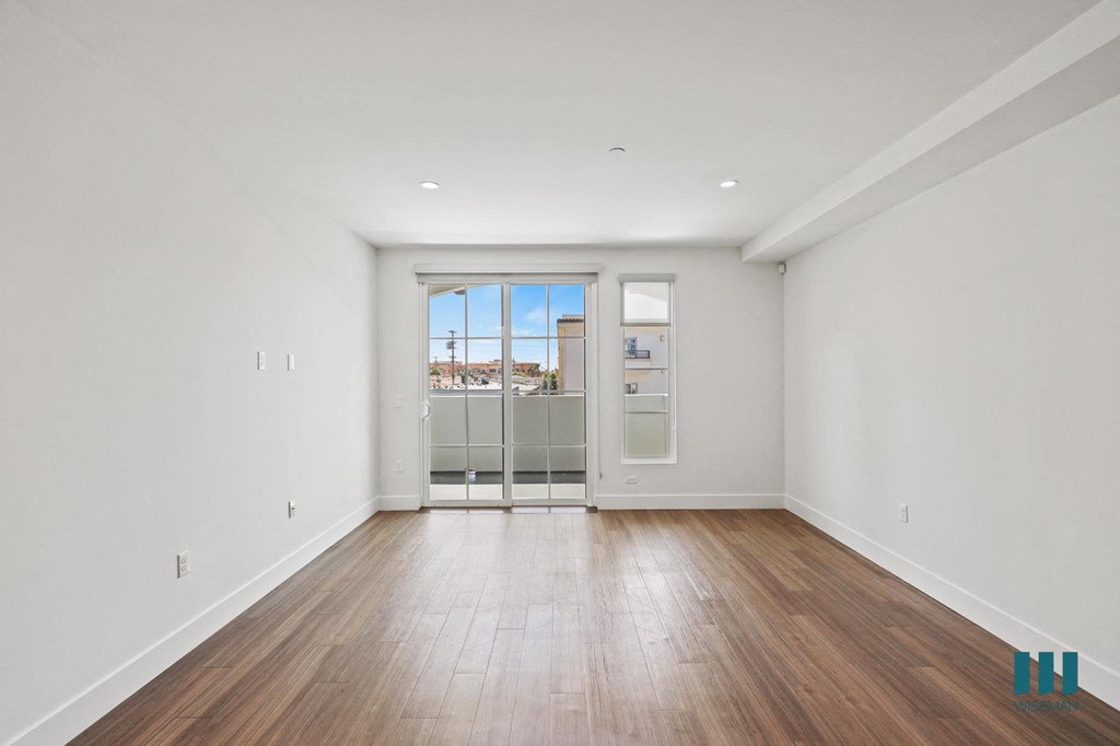 Living Room with Patio, Windows, Vinyl Flooring, and Recessed Lighting