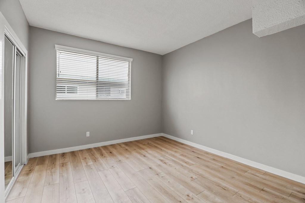 c with Vinyl Flooring and Mirrored Closets