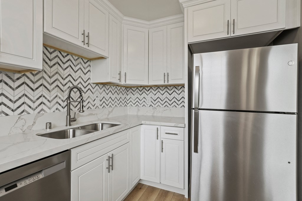 Kitchen with Double-Sinks, Refrigerator, and Dishwasher