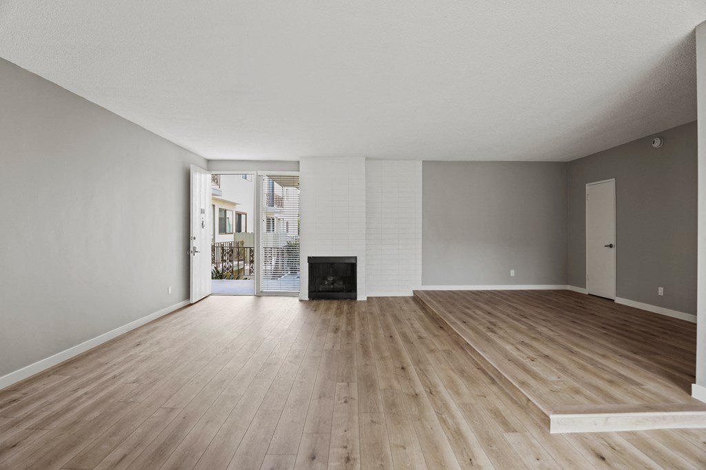 Large-Size Living Room with Electric Fireplace, Vinyl Flooring, and Patio