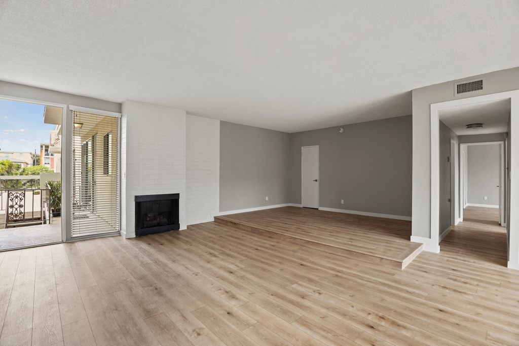 Large-Size Living Room with Electric Fireplace, Vinyl Flooring, and Patio