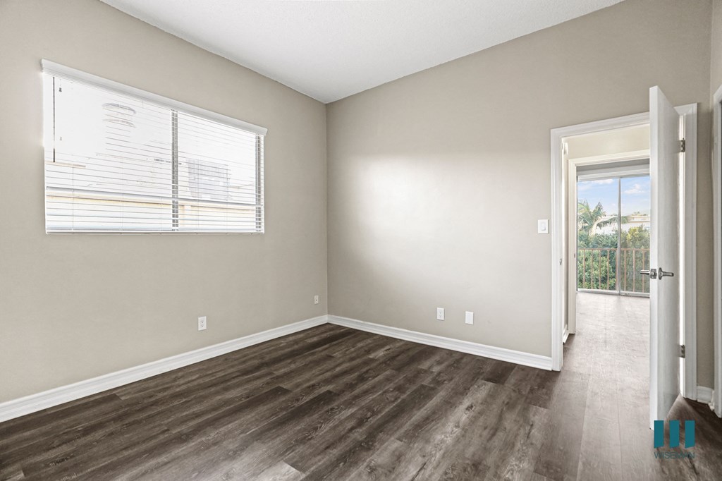 Bedroom with Large Windows and Vinyl Flooring