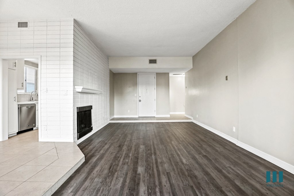 Living Room with Storage Closet and Vinyl Flooring