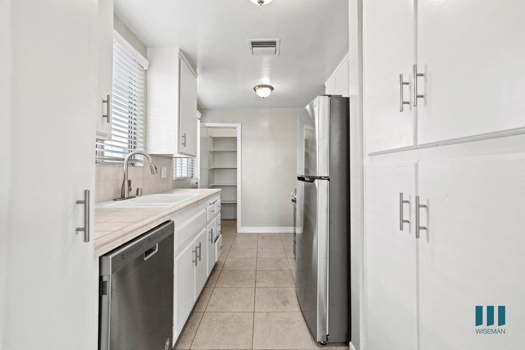 Kitchen with Stainless-Steel Appliances, Cabinet Storage, and Pantry