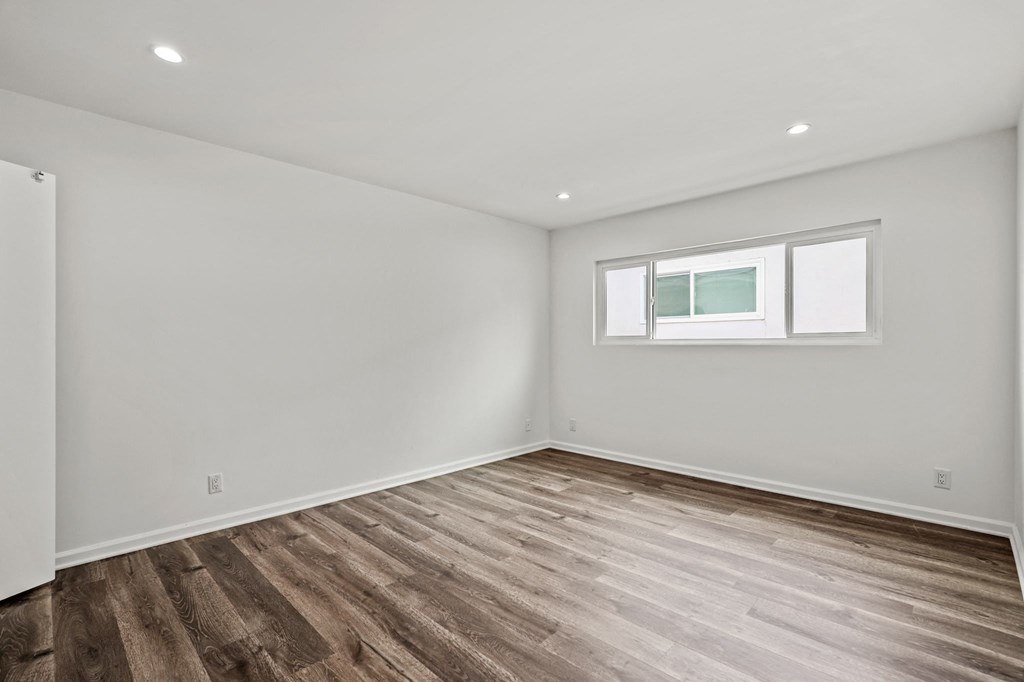 Bedroom with Recessed Lighting, Vinyl Flooring, and Large Windows