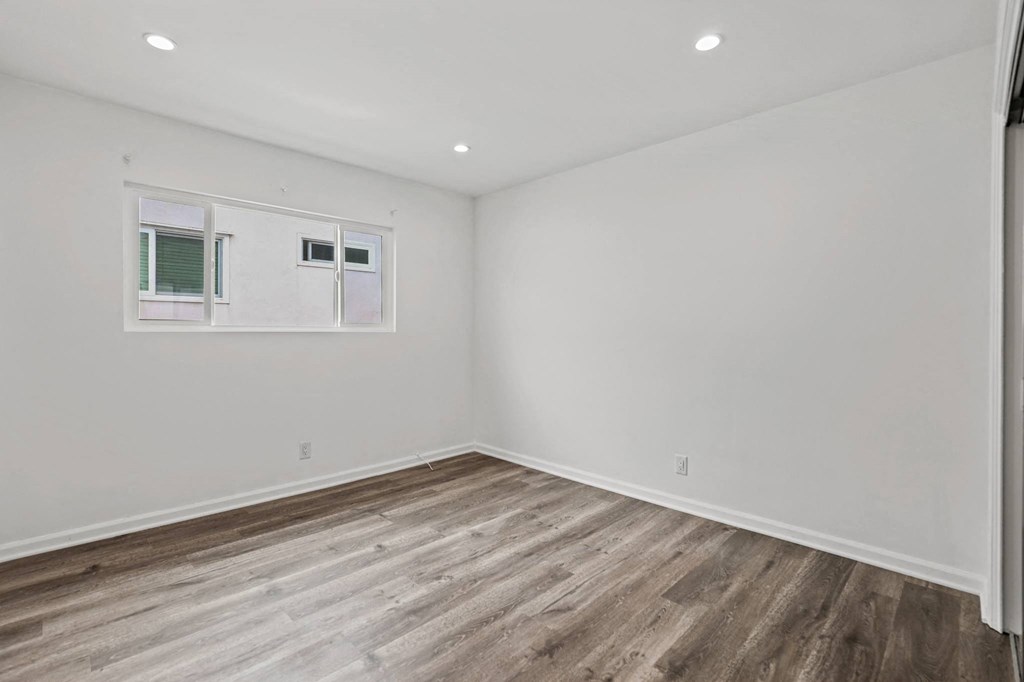 Bedroom with Recessed Lighting, Vinyl Flooring, and Large Windows