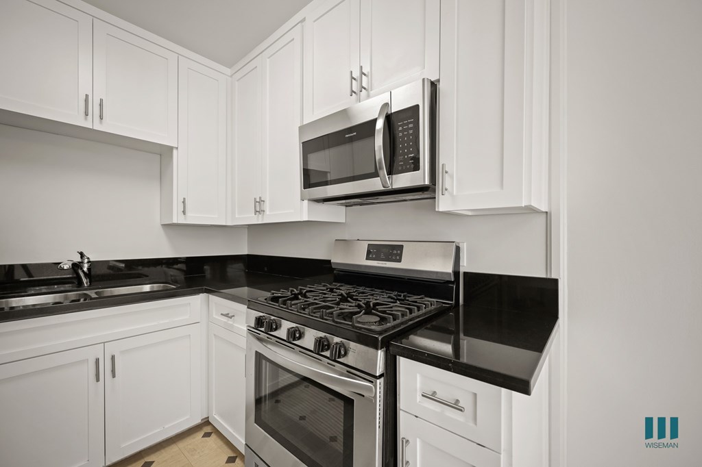 Kitchen with Stainless-Steel Stove and Microwave Oven