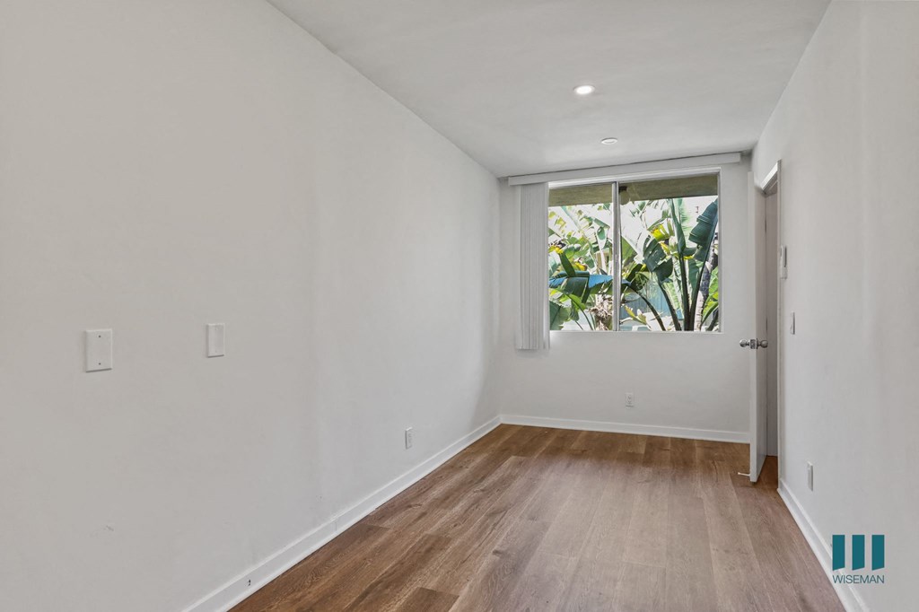 Bedroom with Windows, Vinyl Flooring, and Recessed Lighting