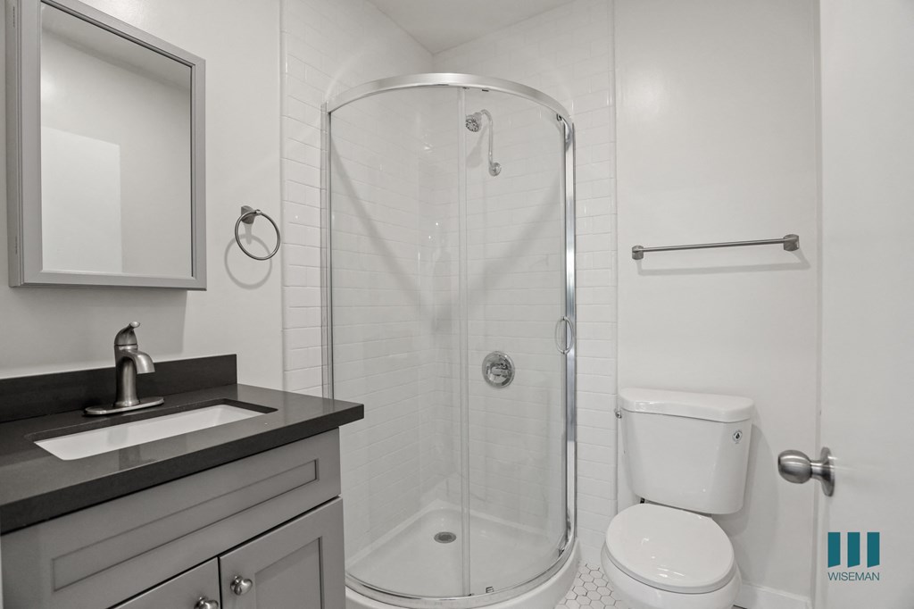 Bathroom with Stand-Up Shower with Glass Door and Vanity Cabinet Storage