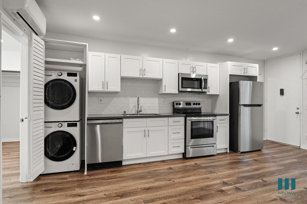 Kitchen with Energy-Efficient Stainless Appliances and In-Suite Washer & Dryer