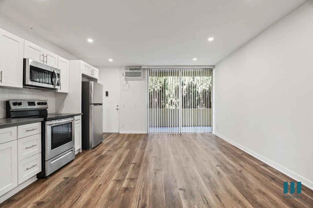 Open-Concept Kitchen, Dining, and Living Room Areas with Large-Size Windows