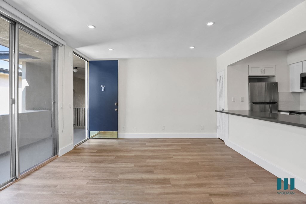 Front Entrance and Open-Concept Kitchen, Dining, and Living Room Areas