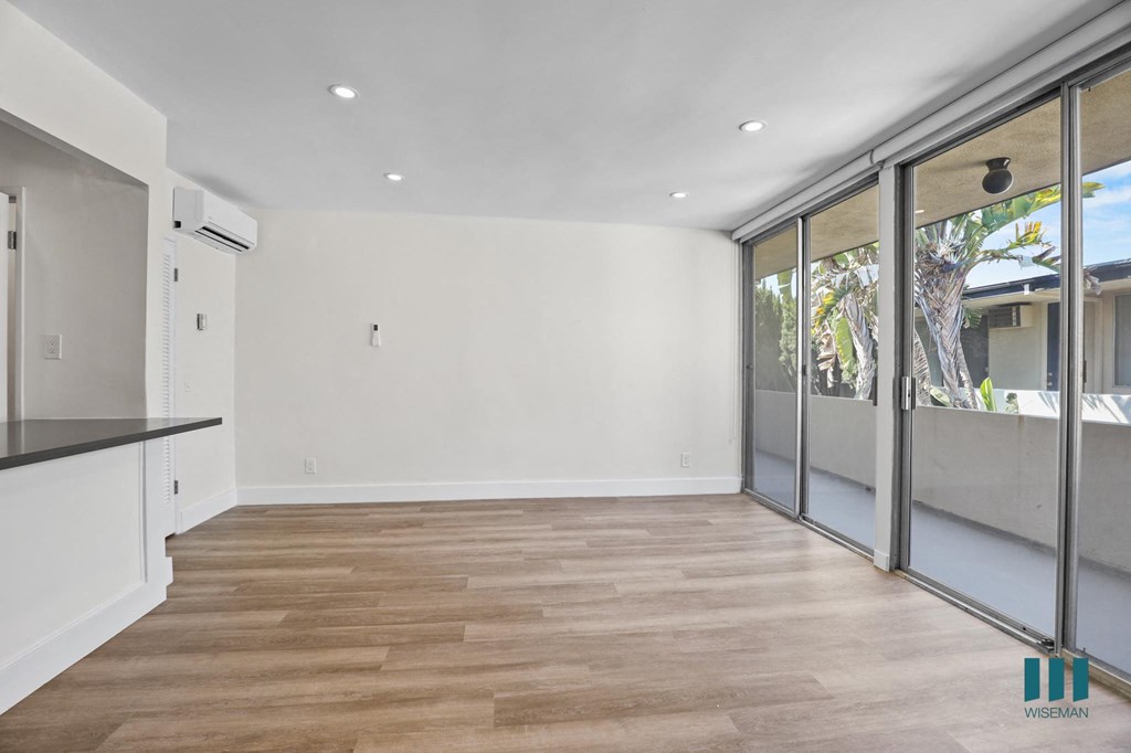 Living Room with Sliding Glass Doors Leading to Balcony