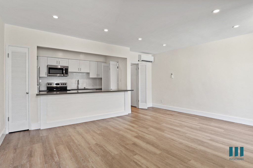 Open-Concept Kitchen, Dining, and Living Room Areas