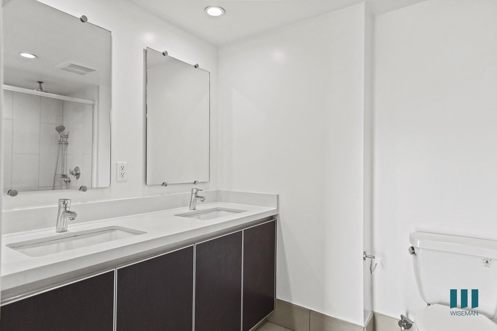 Bathroom with Double-Sink Vanity and Cabinet Storage