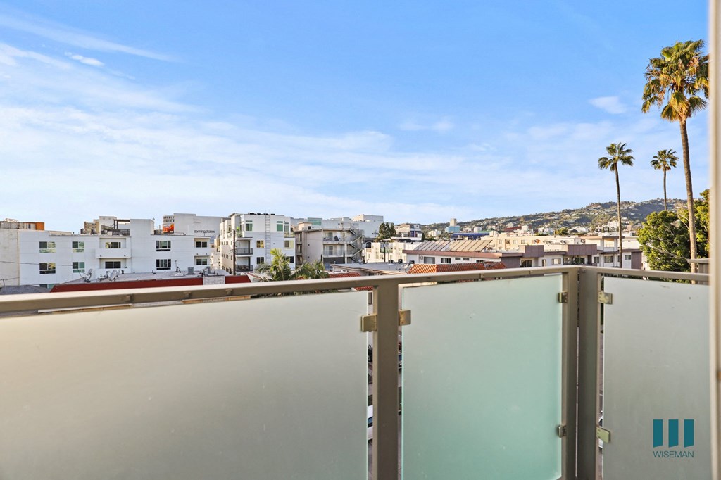 Upper Level Balcony with Skyline Views