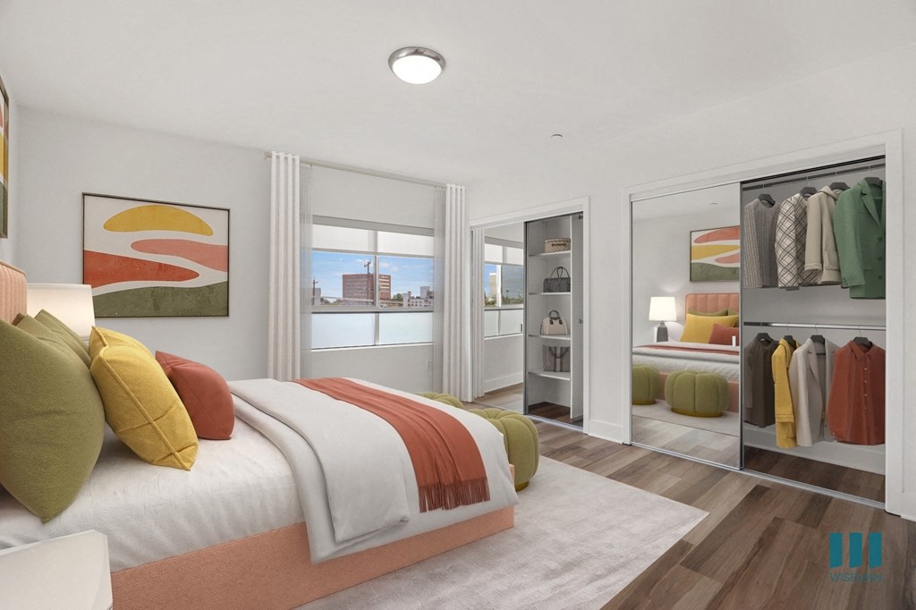 Spacious Bedroom with Two Mirrored Closets with Shelving