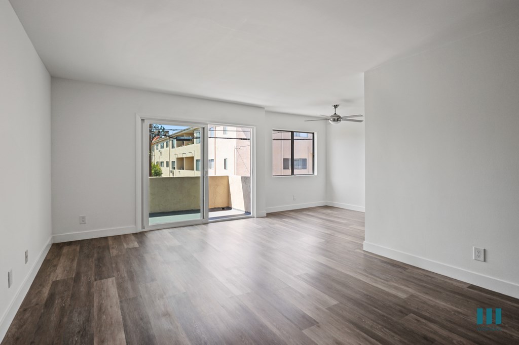 Open-Concept Dining and Living Room with Patio