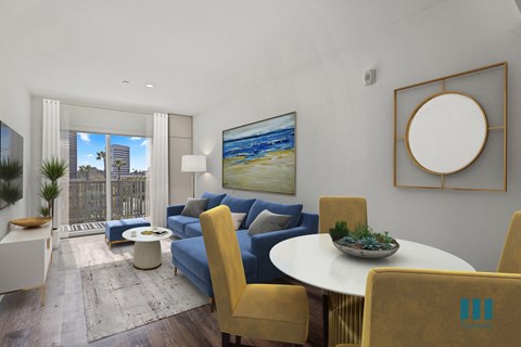 a living room with blue couches and a table and chairs