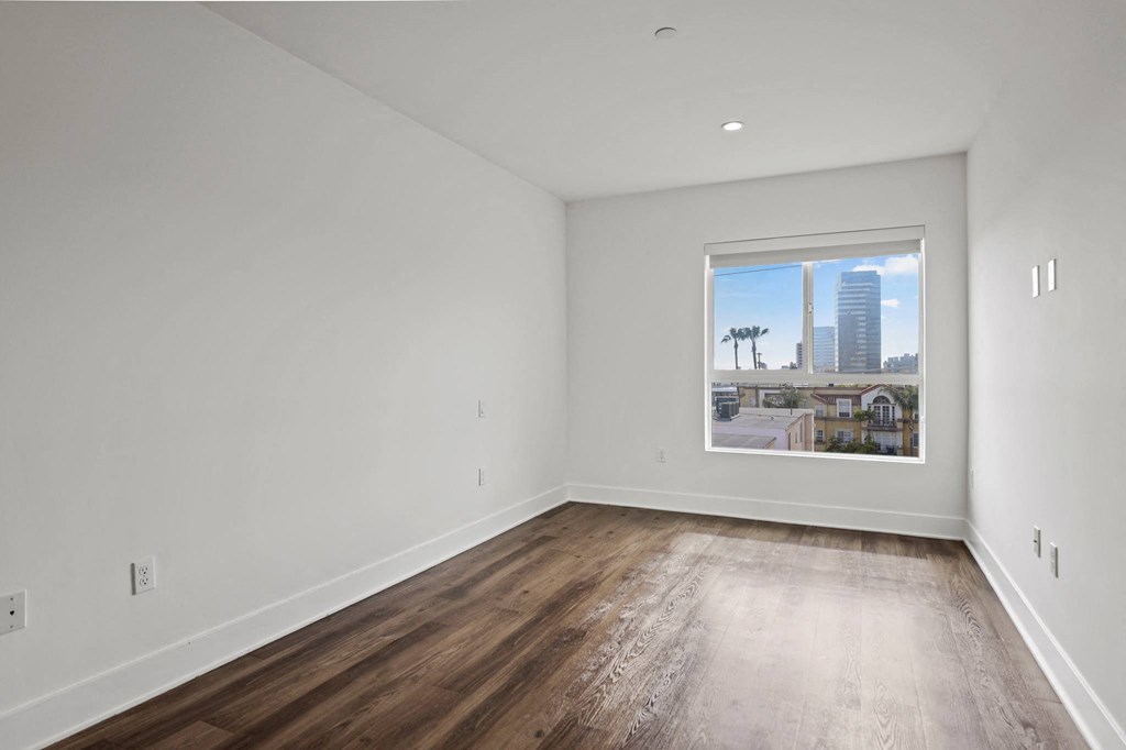 Bedroom with Large Windows and Vinyl Flooring
