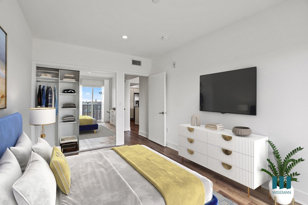 Bedroom with Mirrored Closet with Shelving