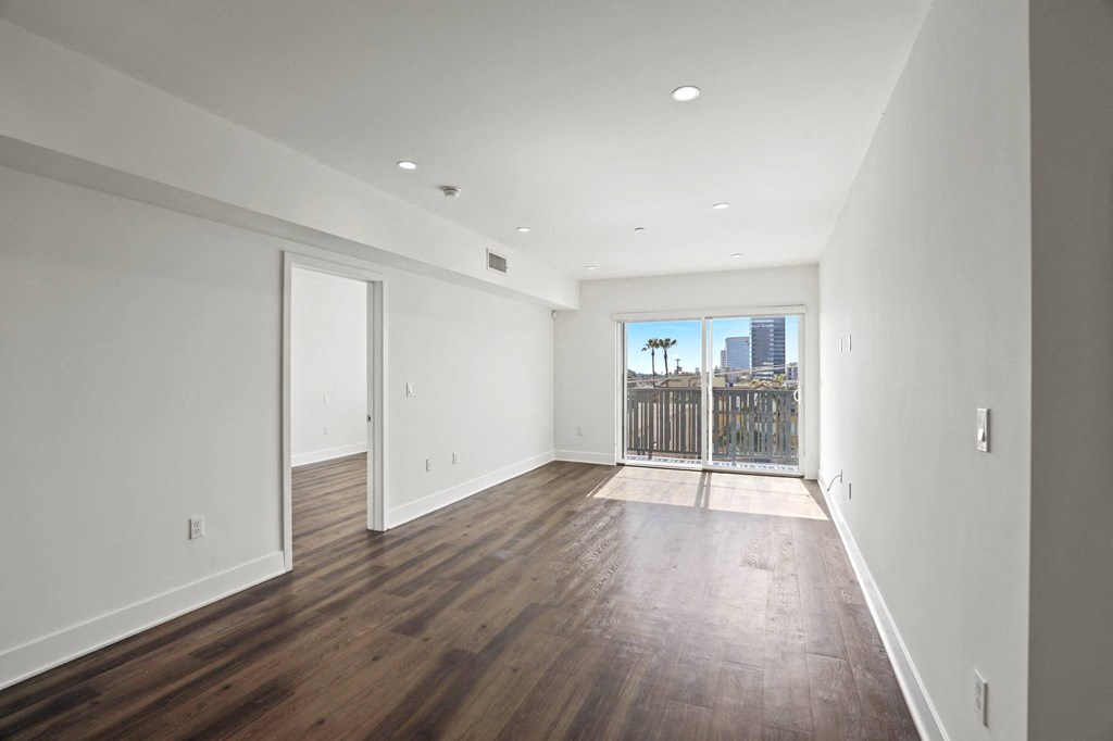 Spacious Living Room with Recessed Lighting and Vinyl Flooring